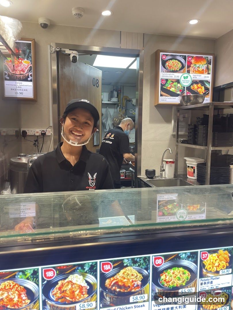 Food Stall Interior with Staff and Menu Display