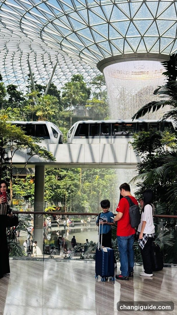 Airport Terminal Interior with Waterfall and Monorail
