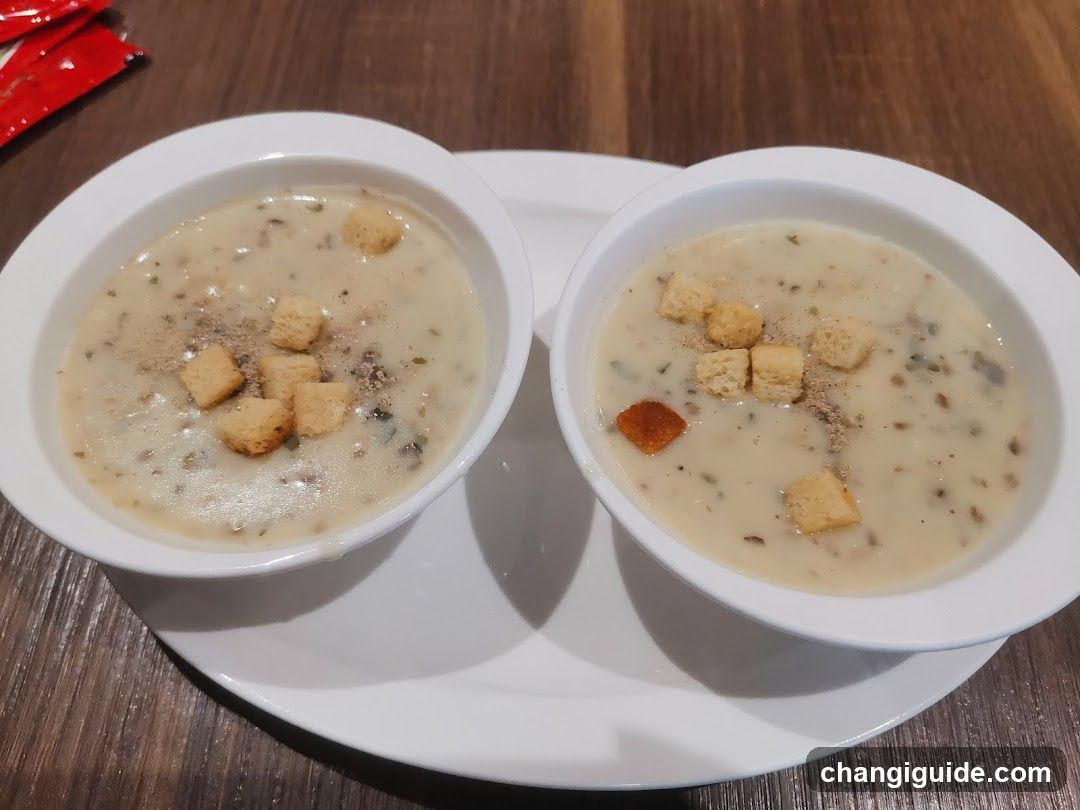 Two Bowls of Creamy Soup with Croutons