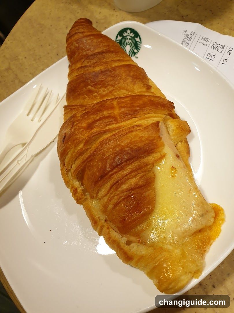 Croissant with Cheese on Starbucks Plate