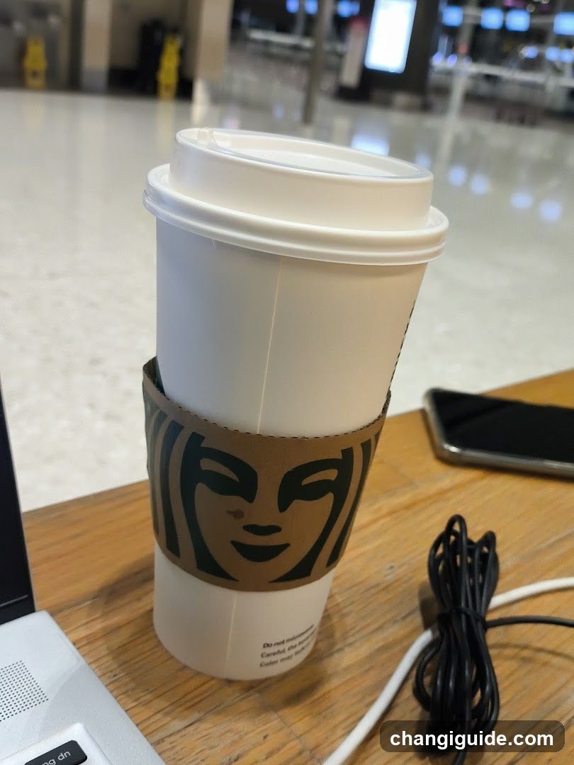 Starbucks Coffee Cup at Airport Terminal