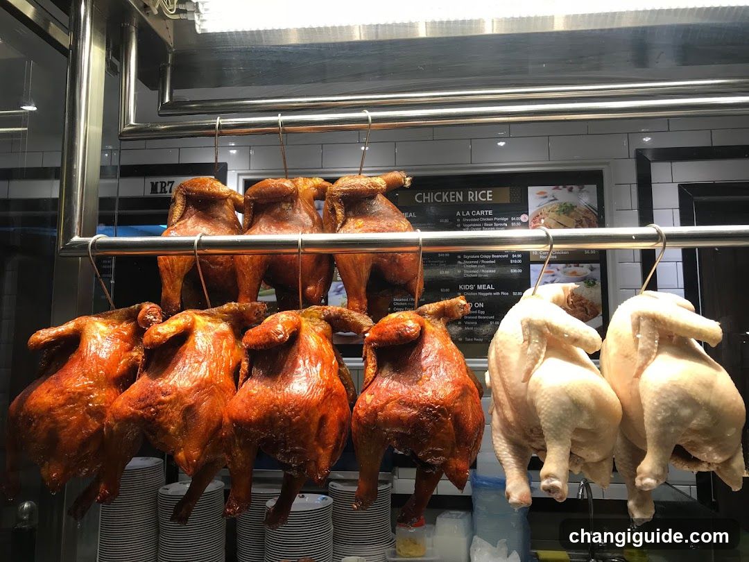 Hanging Roasted and Raw Chickens