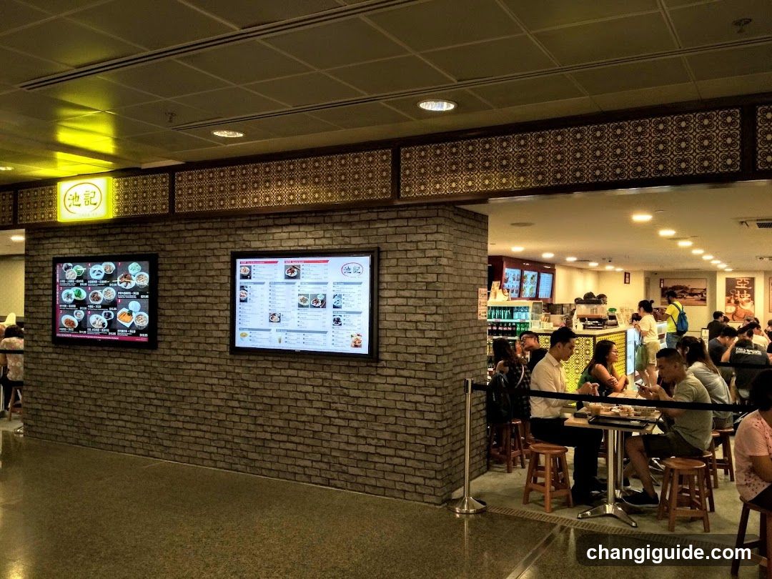 Restaurant Interior with Menu Boards and Patrons