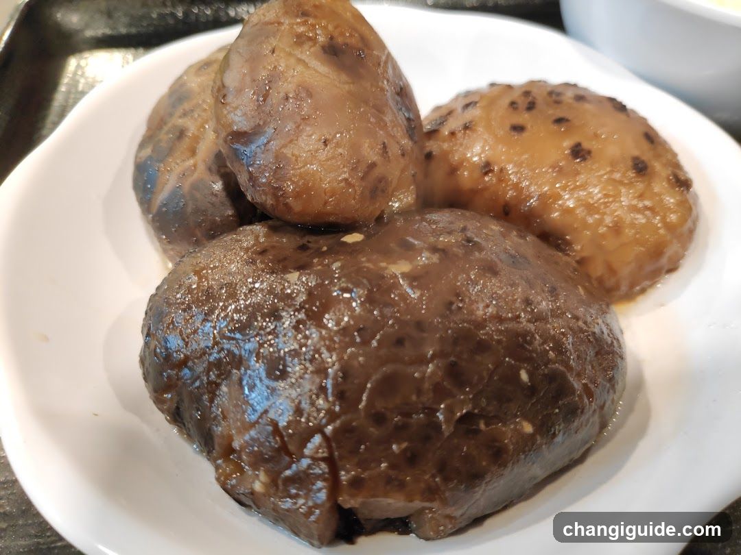 Braised Meatballs on a White Plate