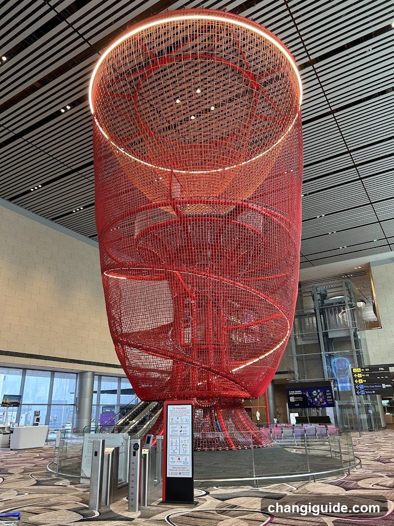 Red Spiral Art Installation in Airport Terminal