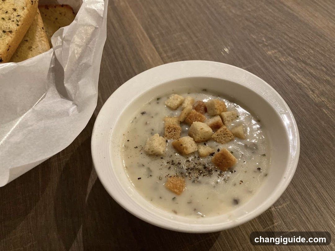 Creamy Soup with Croutons and Garlic Bread