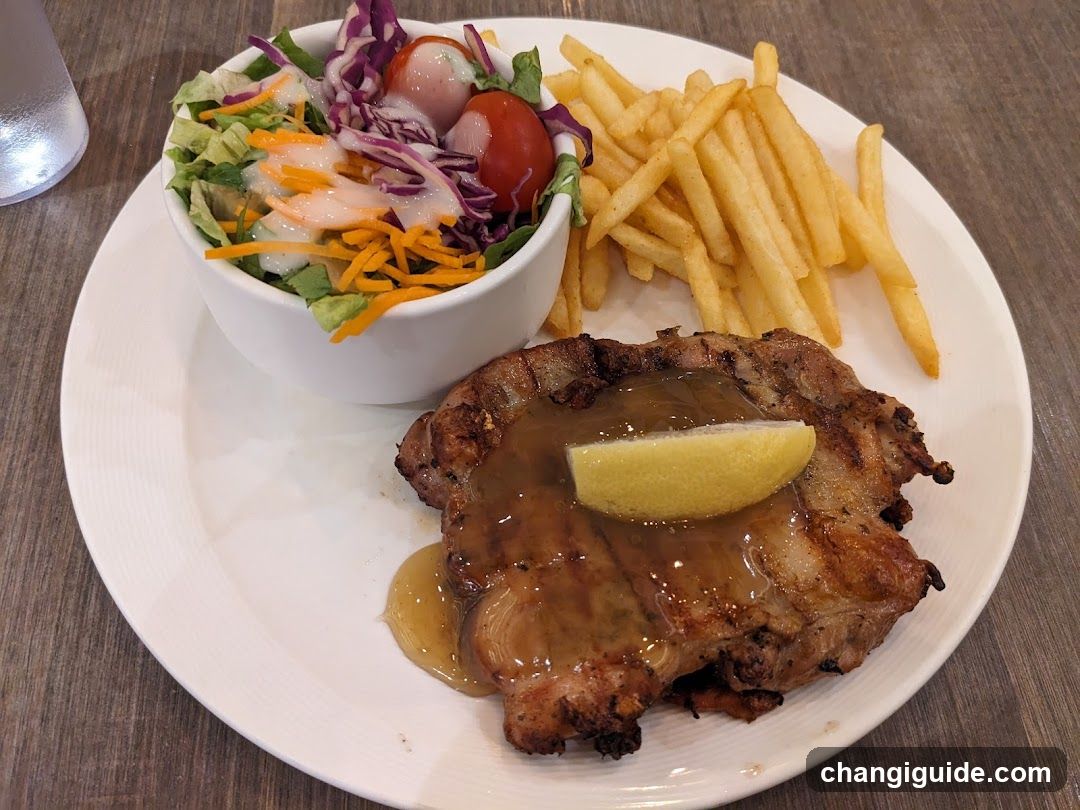 Grilled Pork Chop with Fries and Salad