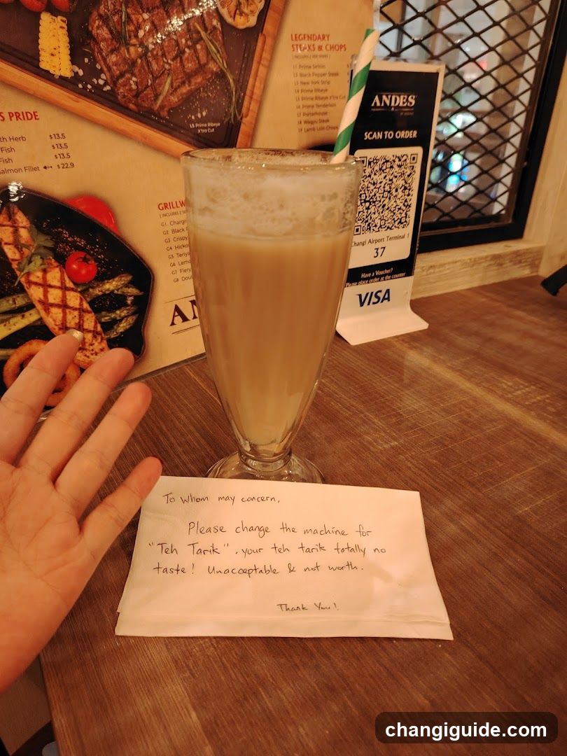 Table with handwritten note and drink