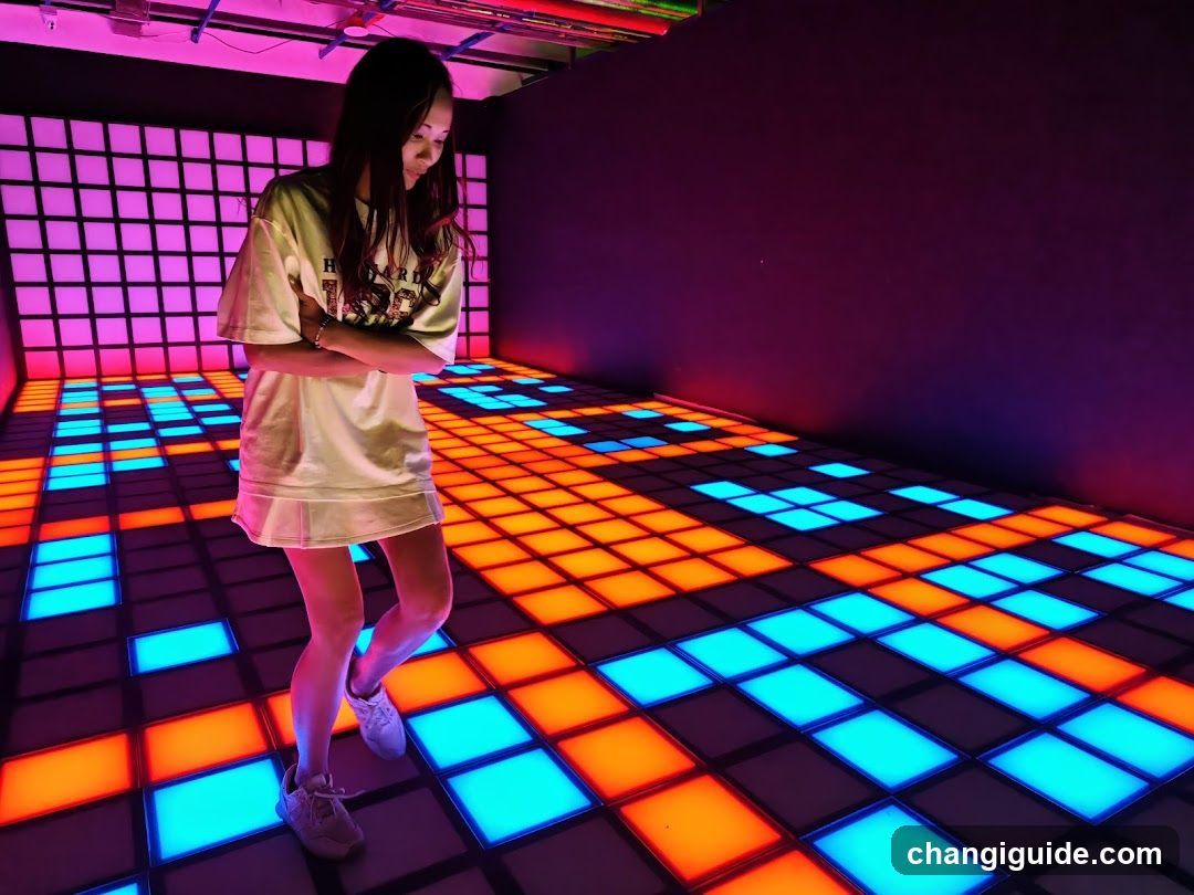 Person in LED Dance Floor Room