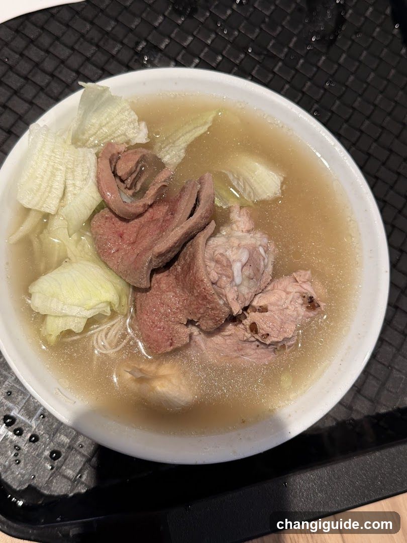 Bowl of Soup with Meat and Vegetables