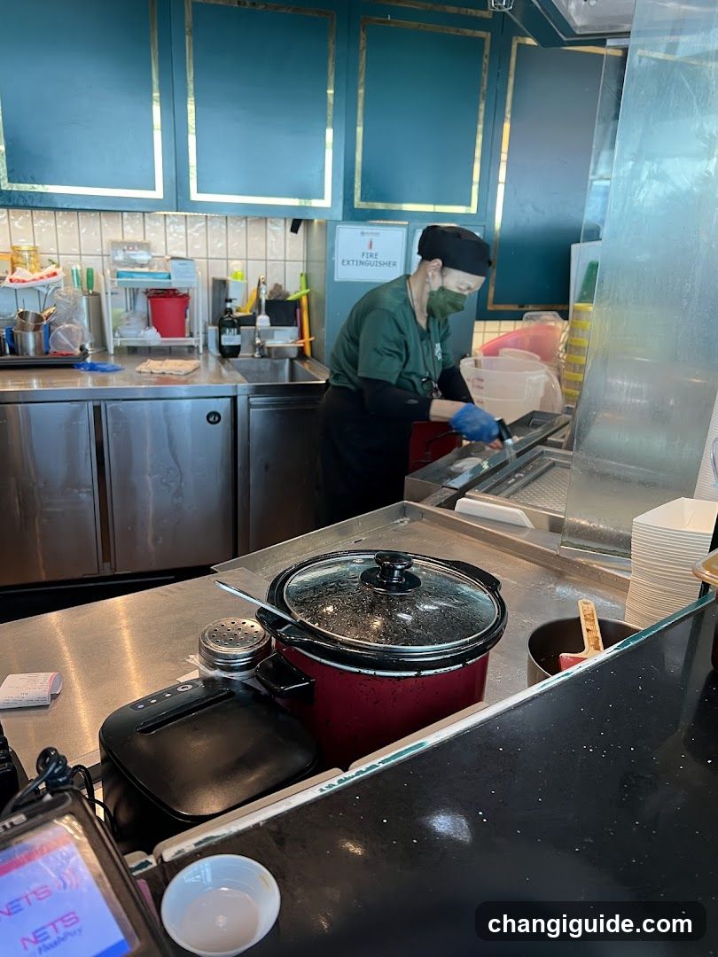Kitchen Interior with Staff Preparing Food