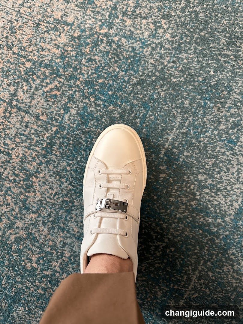 White Sneaker on Patterned Carpet