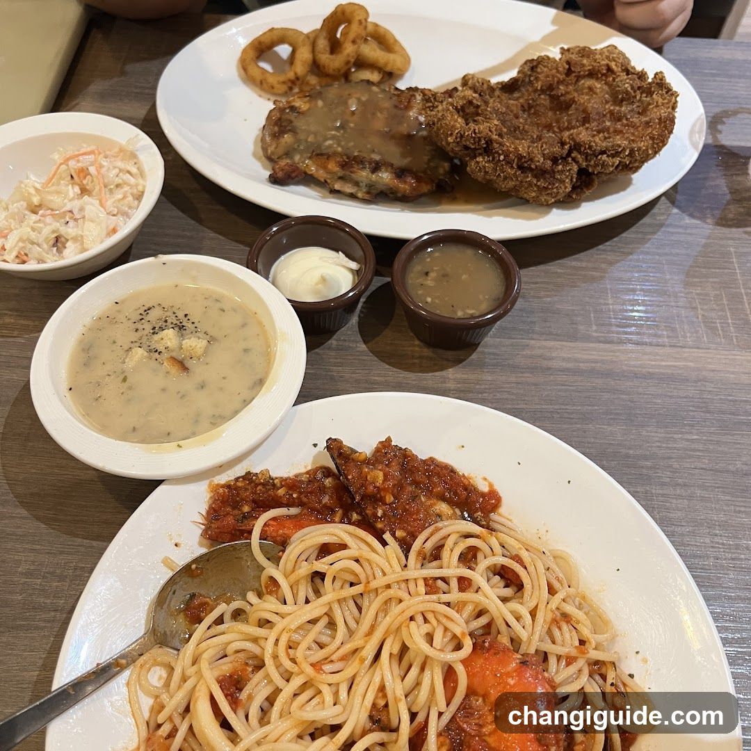 Dining Table Spread with Fried Chicken and Pasta