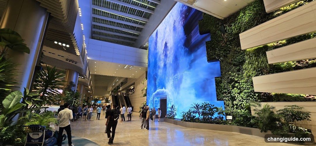 Airport Terminal Interior with Digital Art and Greenery