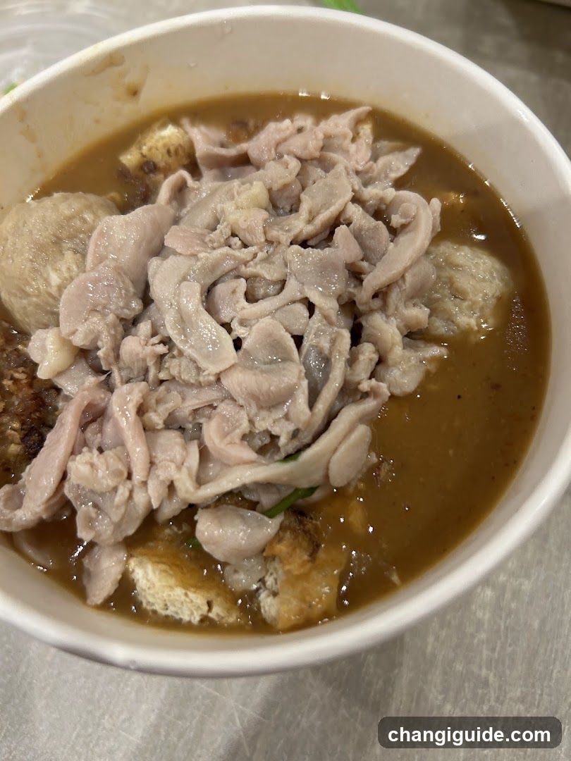 Bowl of Soup with Meat and Dumplings