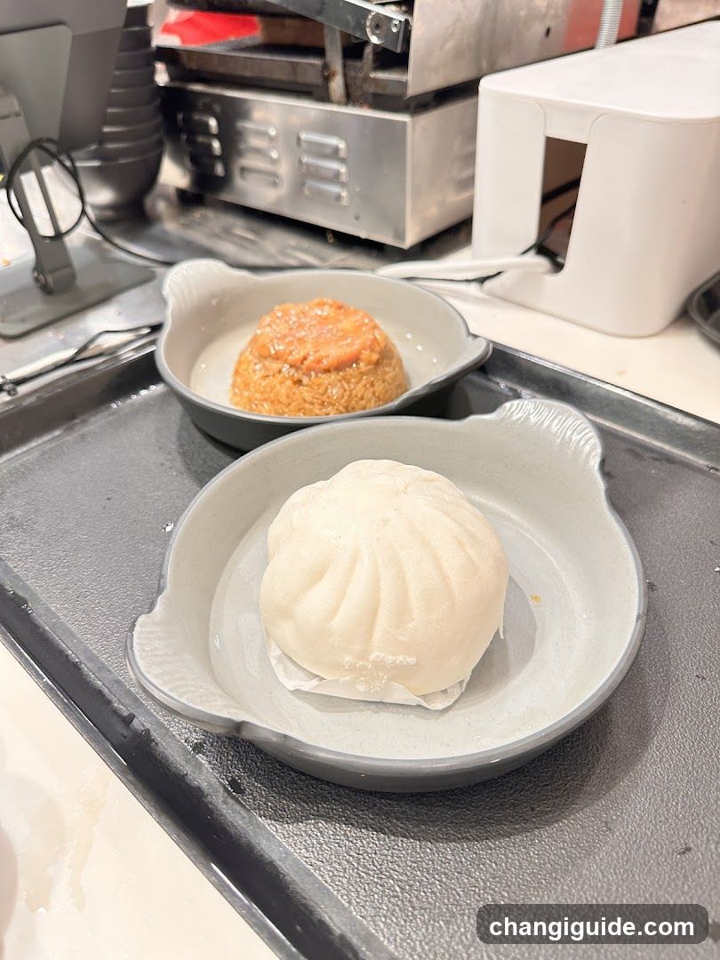 Bun and Rice Dish on Tray