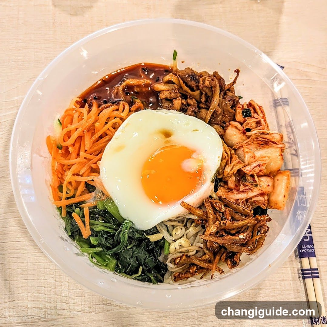 Bowl of Korean-style noodles with egg and toppings