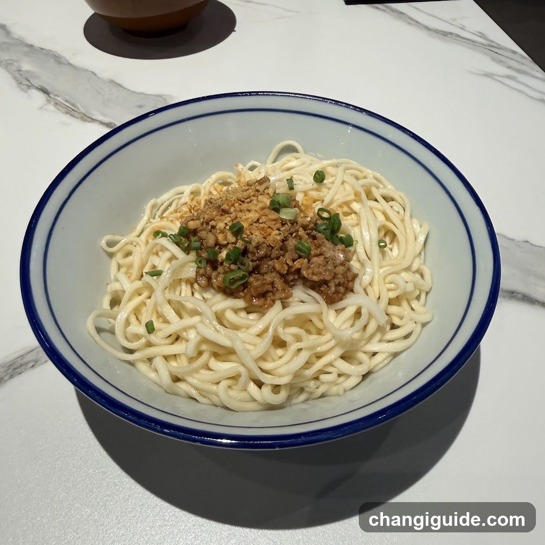 Bowl of noodles with minced meat and green onions