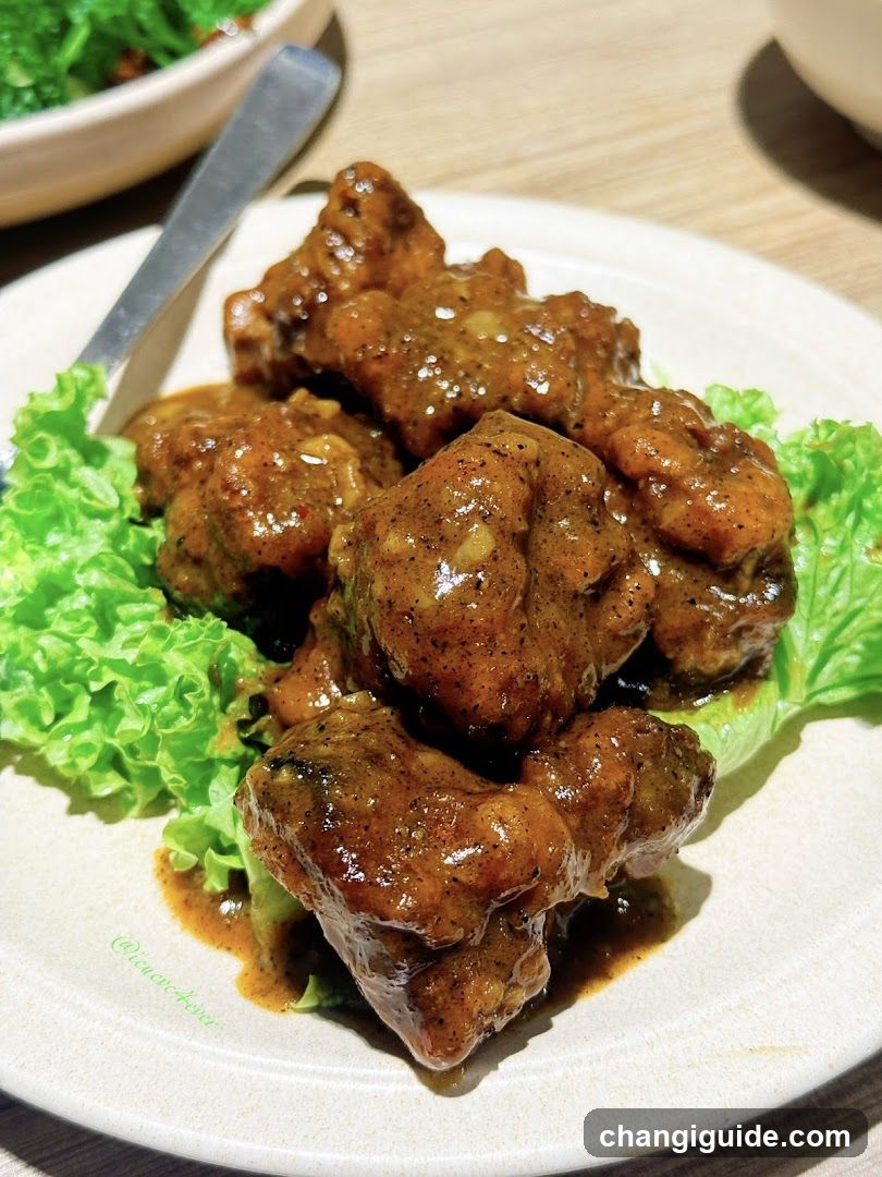 Sauced Meat Dish with Lettuce Garnish