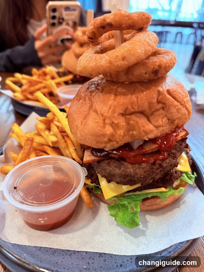 Loaded Burger with Onion Rings and Fries