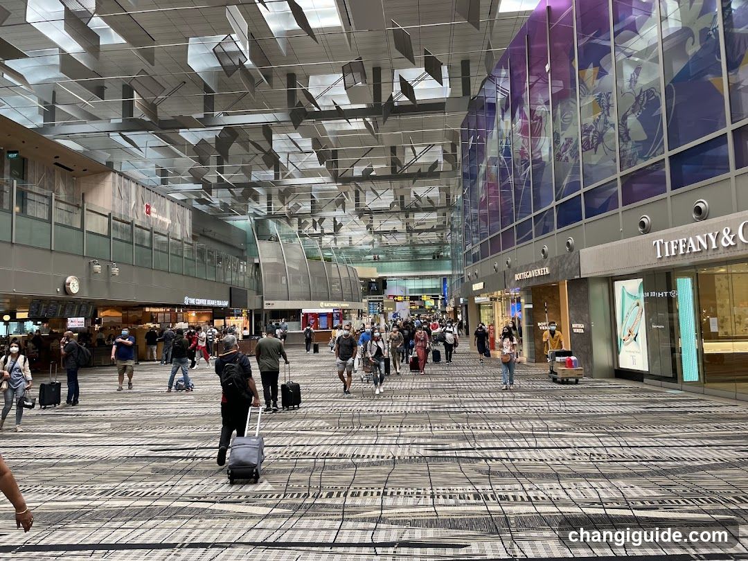 Airport Terminal Interior with Shops and Travelers