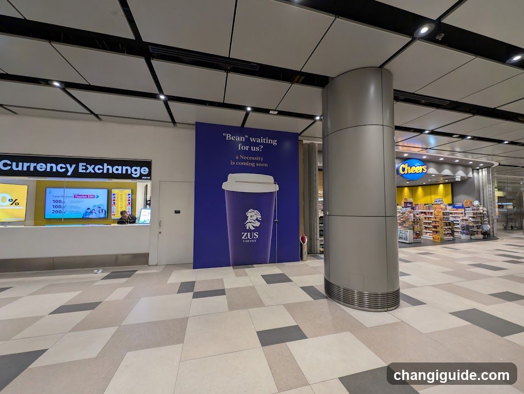 Airport Terminal Interior with Currency Exchange and Coffee Ad