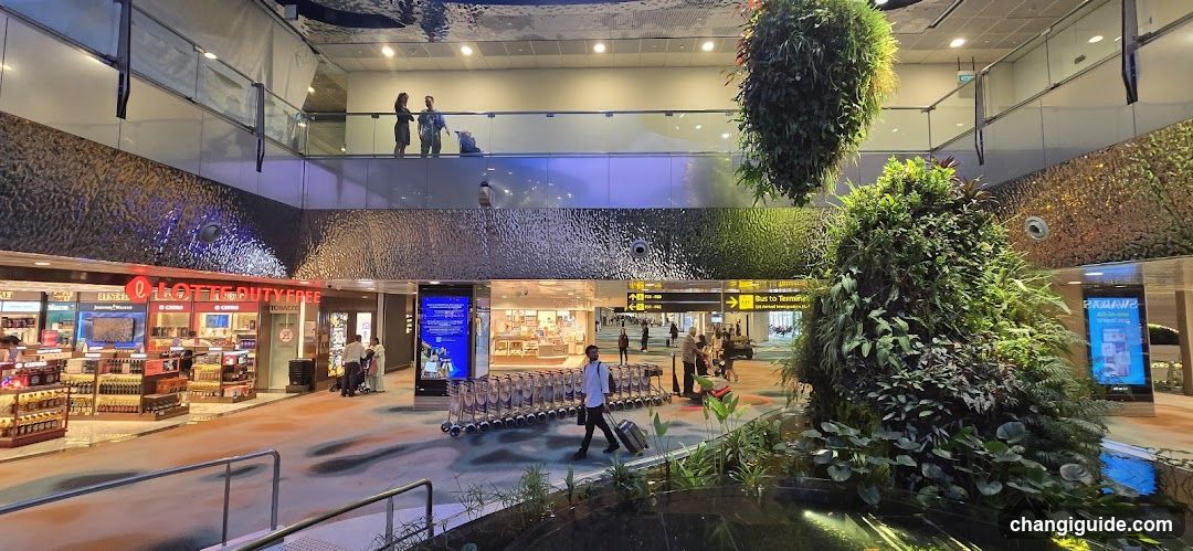 Airport Terminal Interior with Duty-Free Shop and Greenery