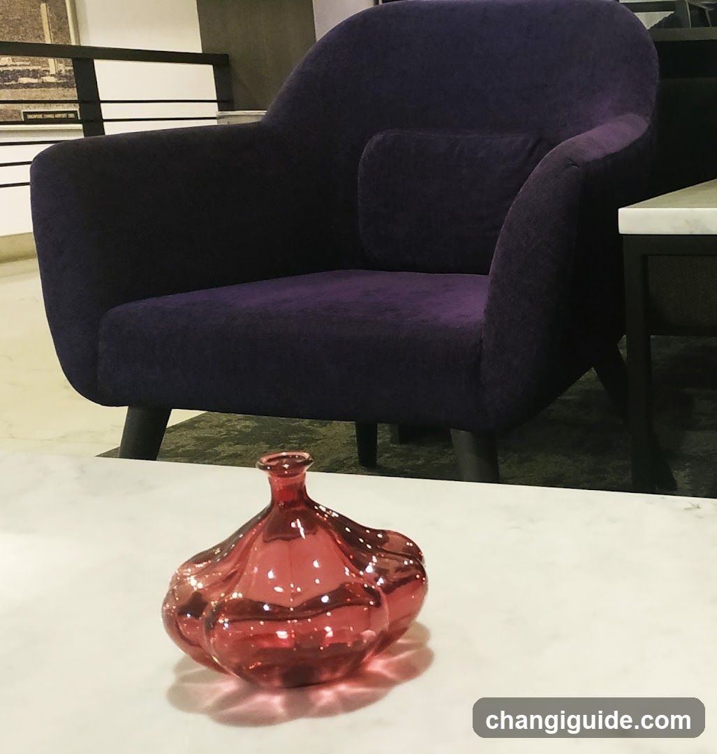 Purple Armchair and Red Vase