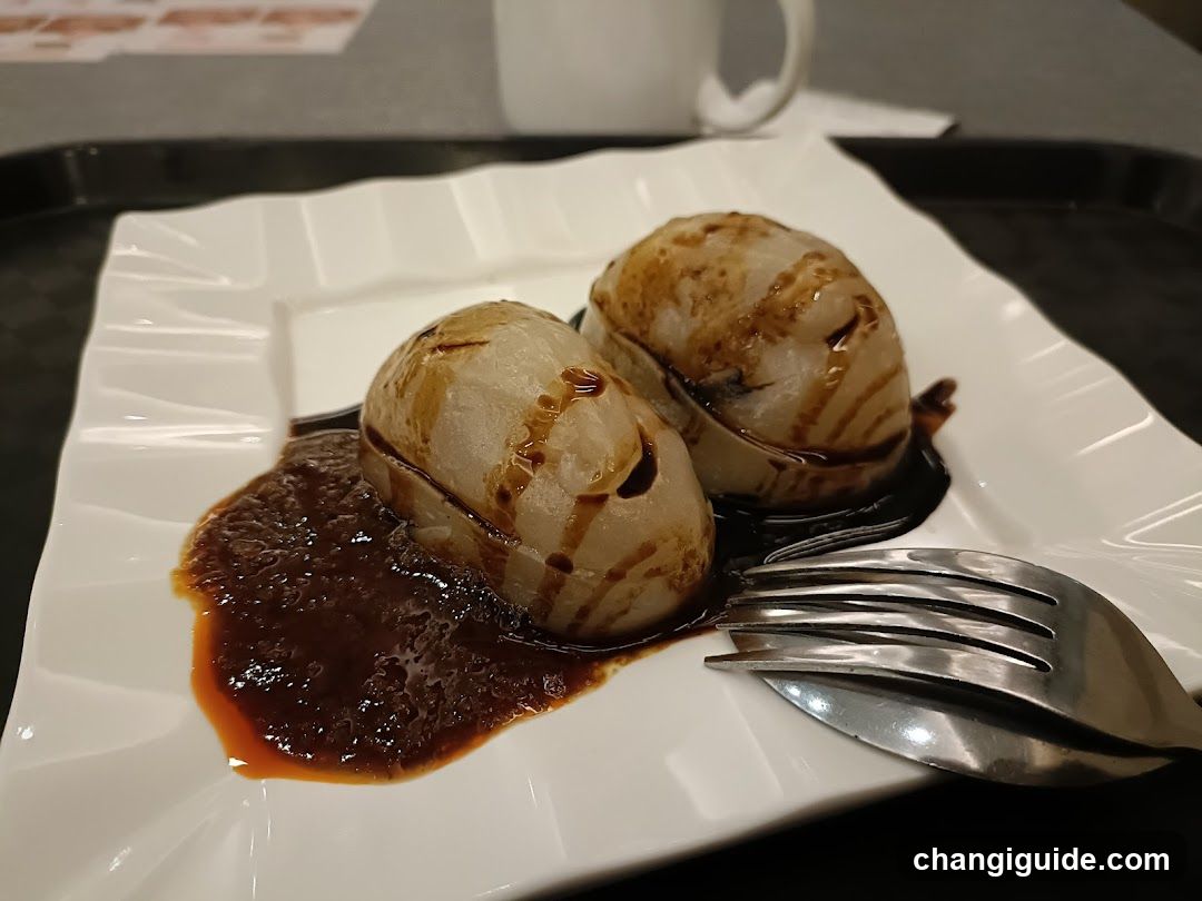 Sauced Dumplings on a Plate