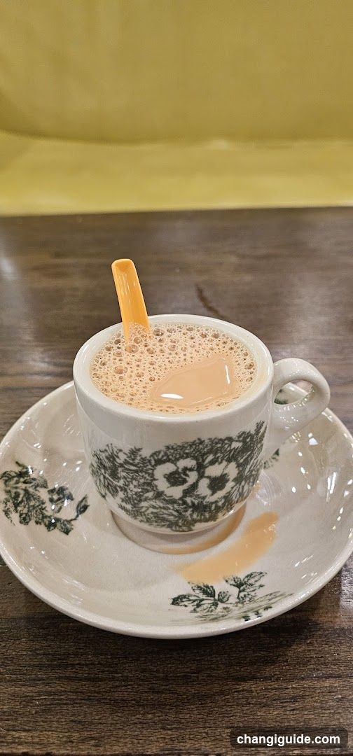 Cup of Tea with Orange Spoon