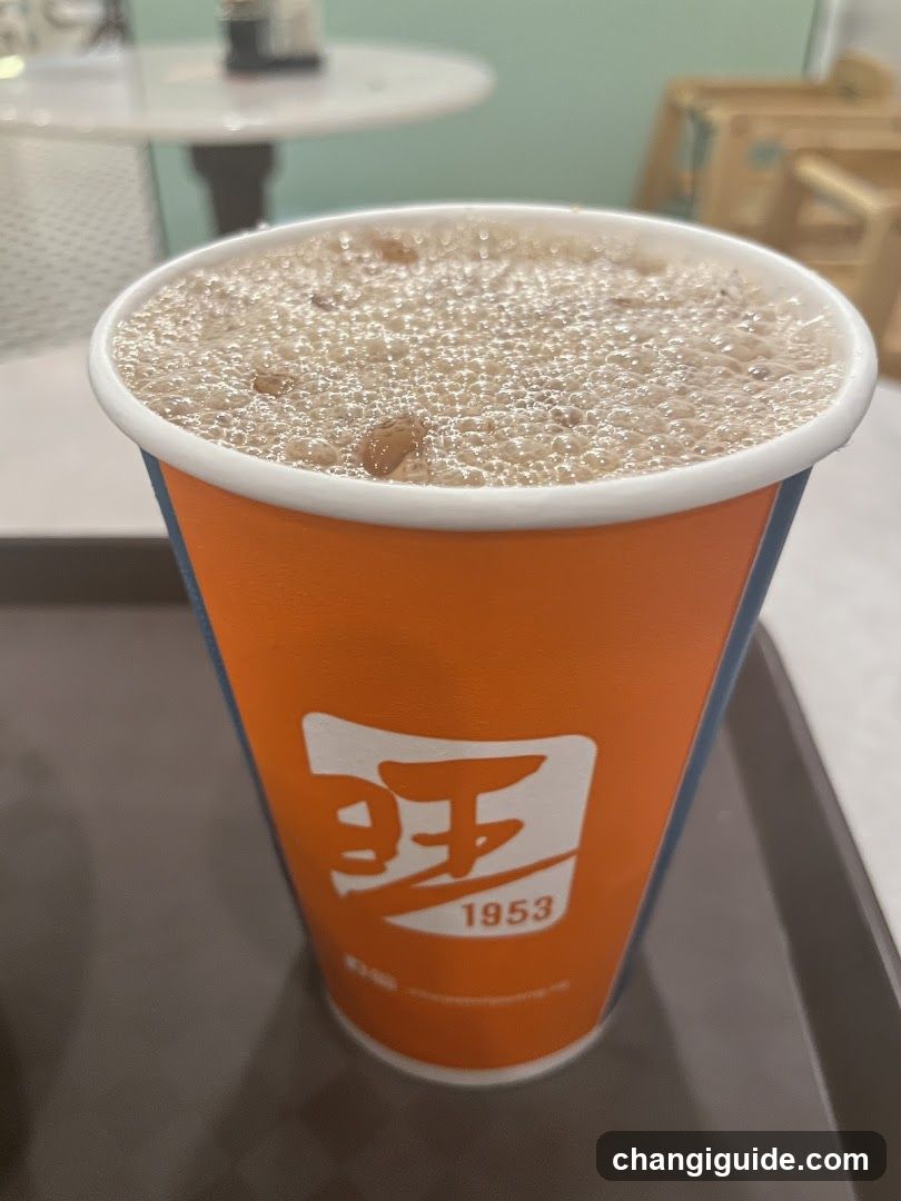 Beverage in branded cup