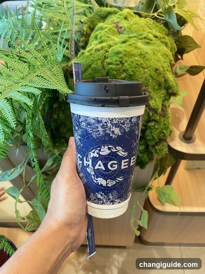Chagee Coffee Cup with Greenery Background