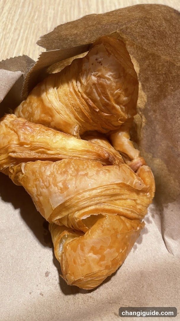 Croissant in Paper Wrapper