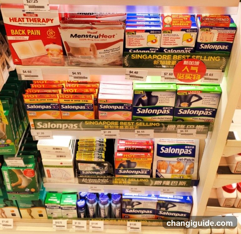 A close-up view of a retail shelf stocked with various pain relief and therapeutic products, including Salonpas patches, MenstruHeat pads, and heat therapy wraps. Price tags are visible on each item.
