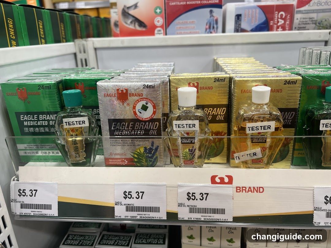Shelf display of Eagle Brand medicated oils in green, silver, and gold packaging with tester bottles attached. Price tags show $5.37 each.