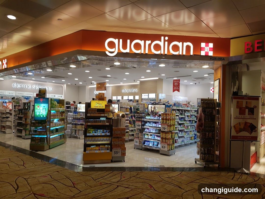 The image shows the exterior entrance of a Guardian pharmacy store, identifiable by its illuminated signage with the brand name 'guardian' and logo. The storefront features glass doors and windows, allowing visibility into the well-lit interior where various health products are displayed on shelves. A sign reading 'derma skincare' is visible inside, along with other product categories like vitamins. The floor outside has a patterned carpet design.