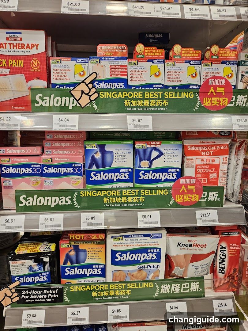 Shelf display of Salonpa patches and gel-patches, including Singapore Best Selling label, Hot and Cold relief options, and various sizes.