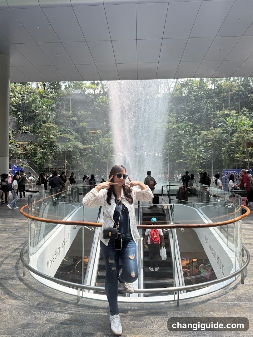 Woman posing in a modern atrium with fountain