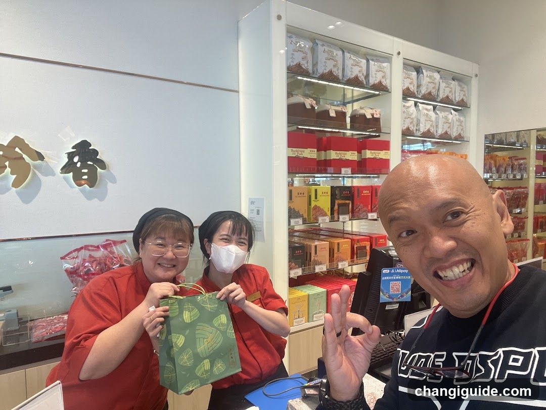 Staff with Gift Bag in Store Interior
