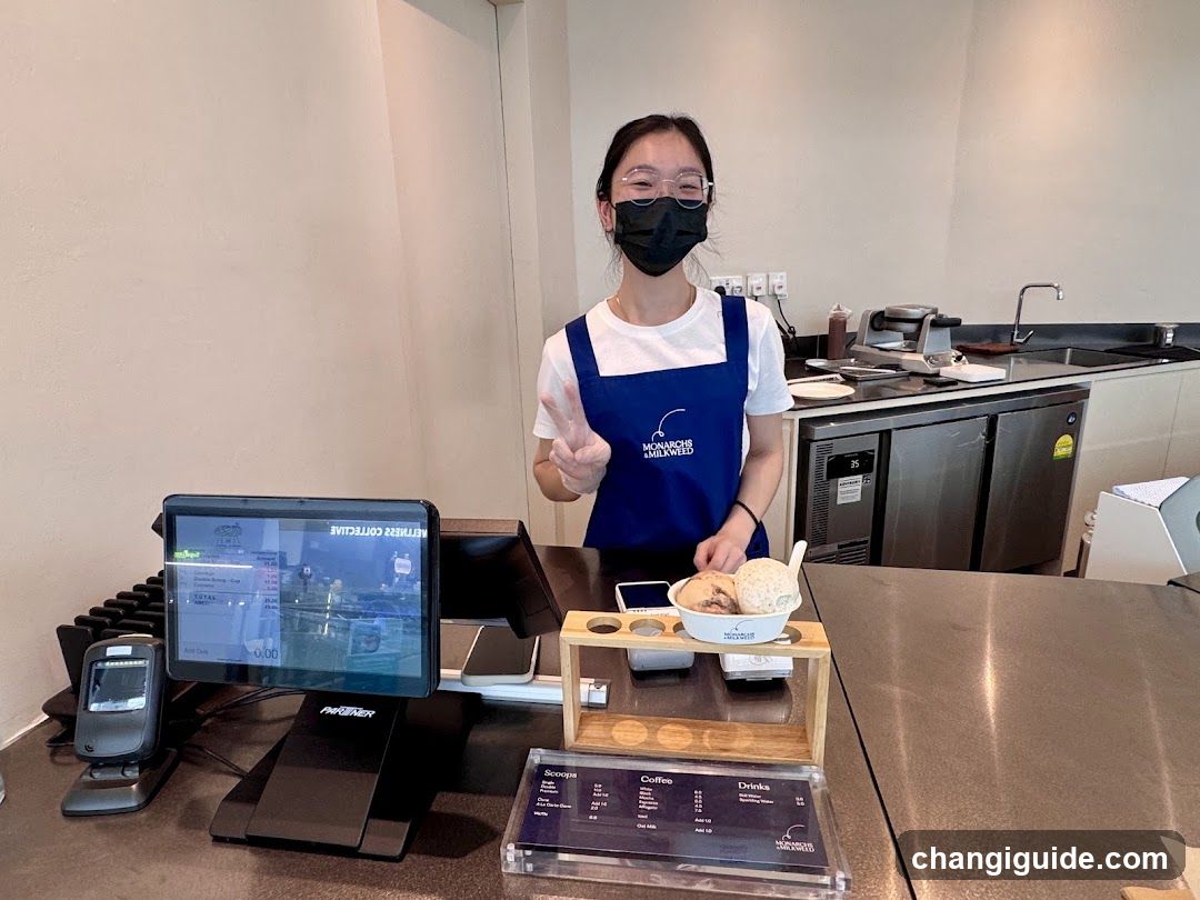Barista with ice cream at counter