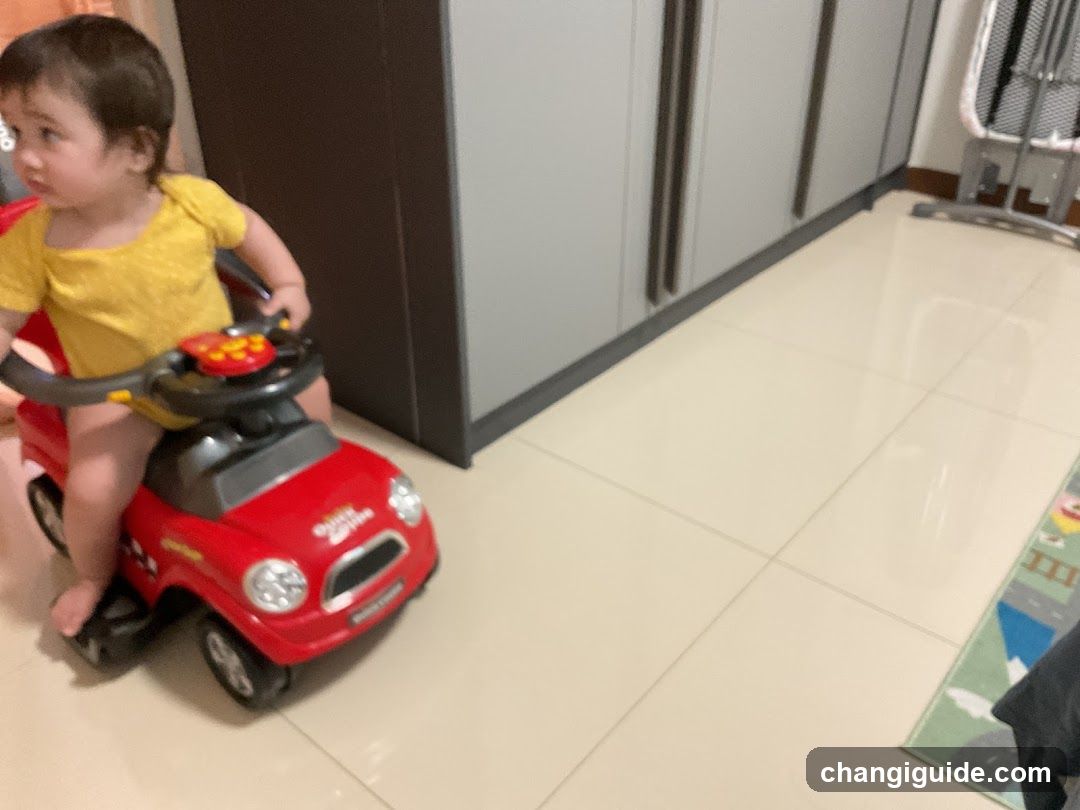 Toddler in Toy Car