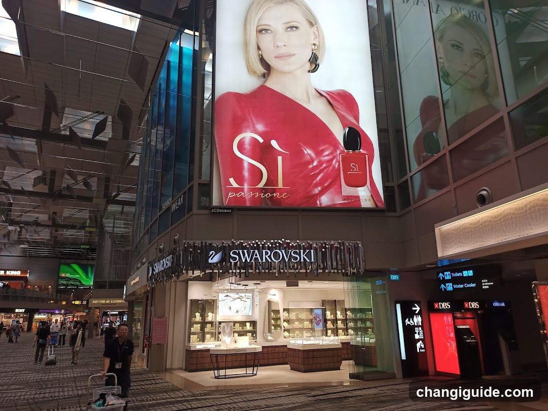Swarovski Storefront with Si Parfums Advertisement
