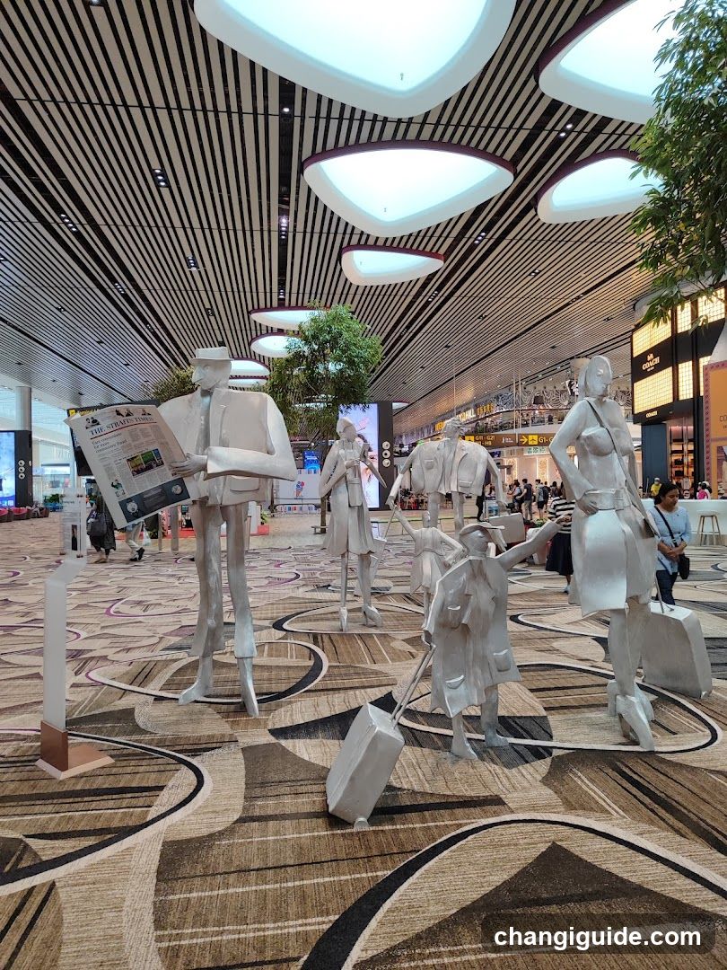 Traveler Sculptures in Airport Terminal