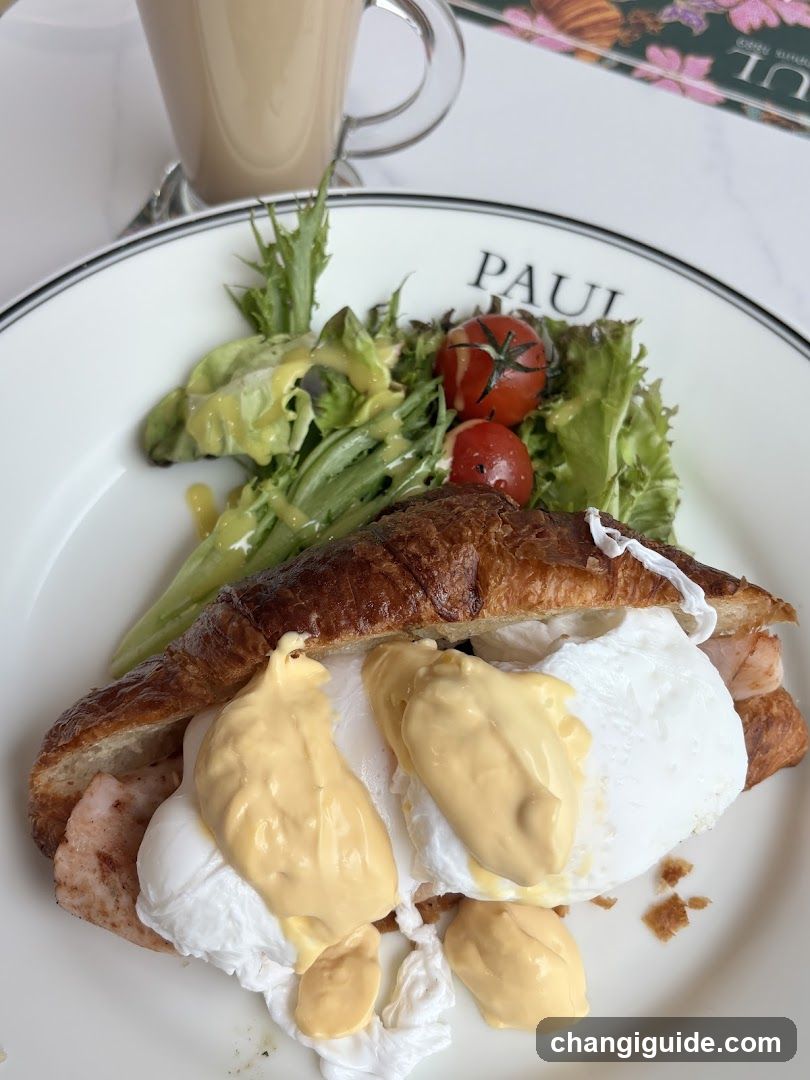 Croissant with Poached Eggs and Salad
