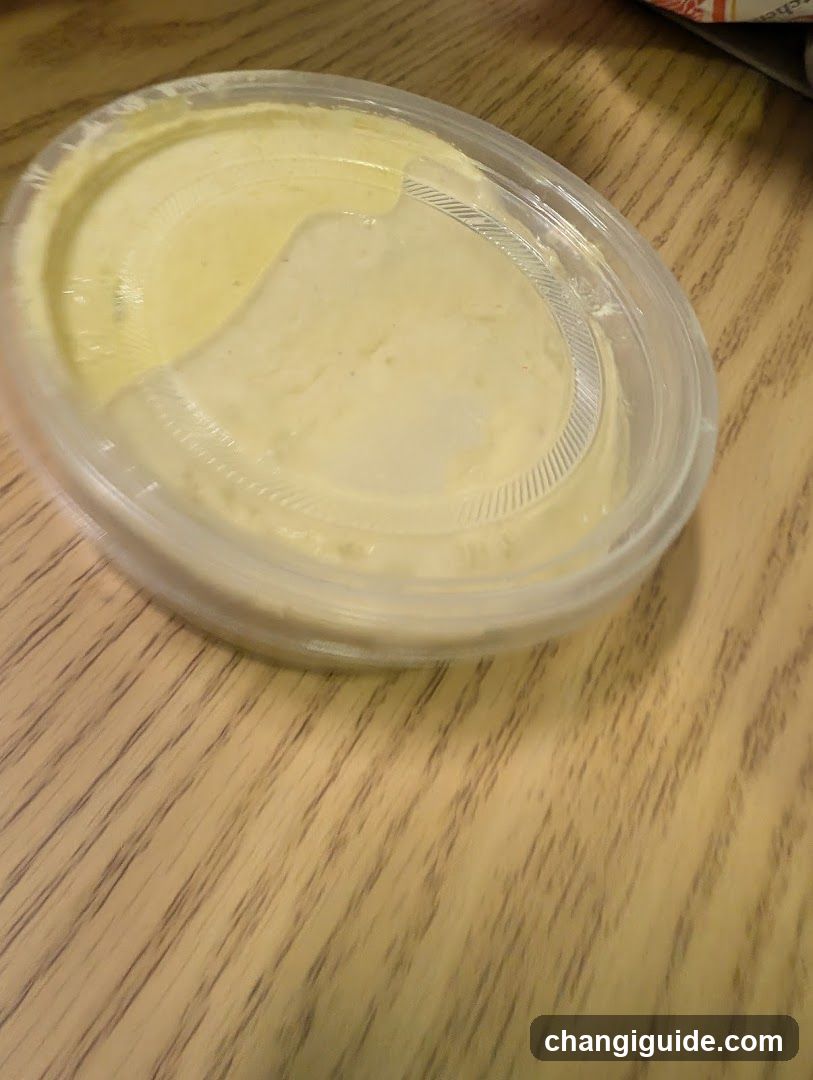 Hummus in plastic container