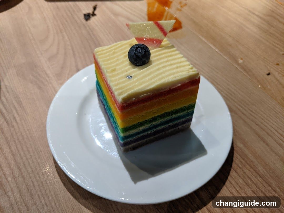 Rainbow Layer Cake Slice