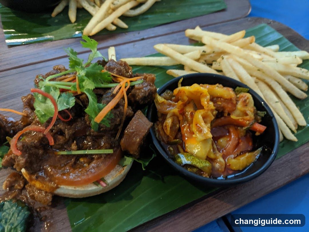 Spicy Meat Burger with Fries and Pickles