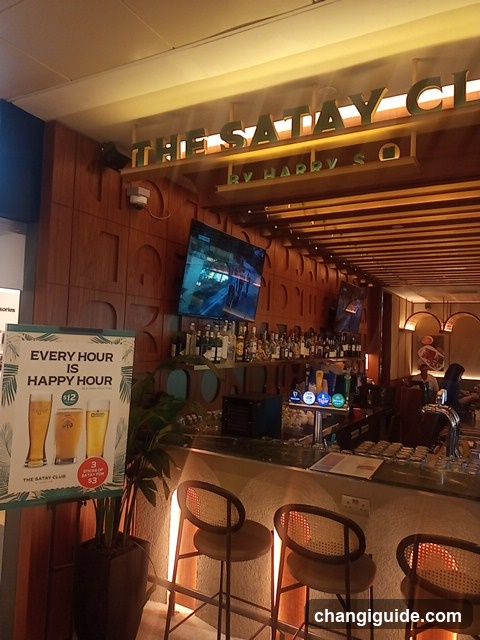 Bar Interior with Happy Hour Sign