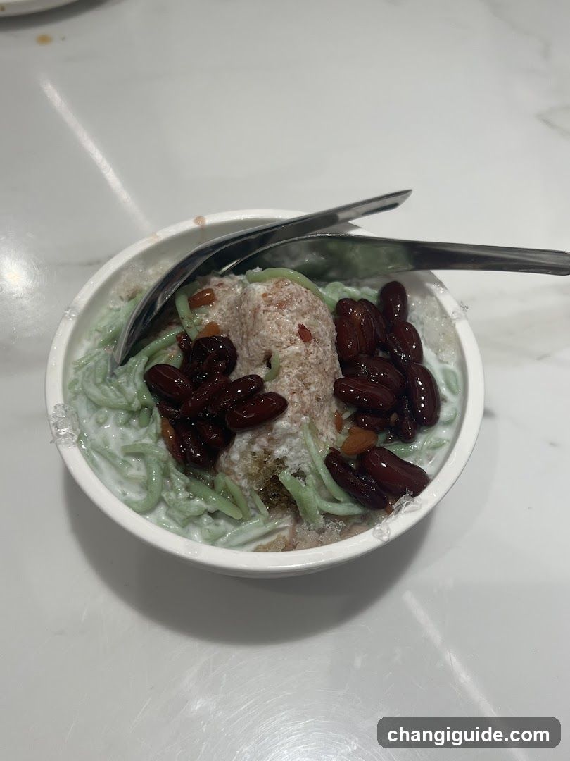 Bowl of Green Noodles with Red Beans and Coconut