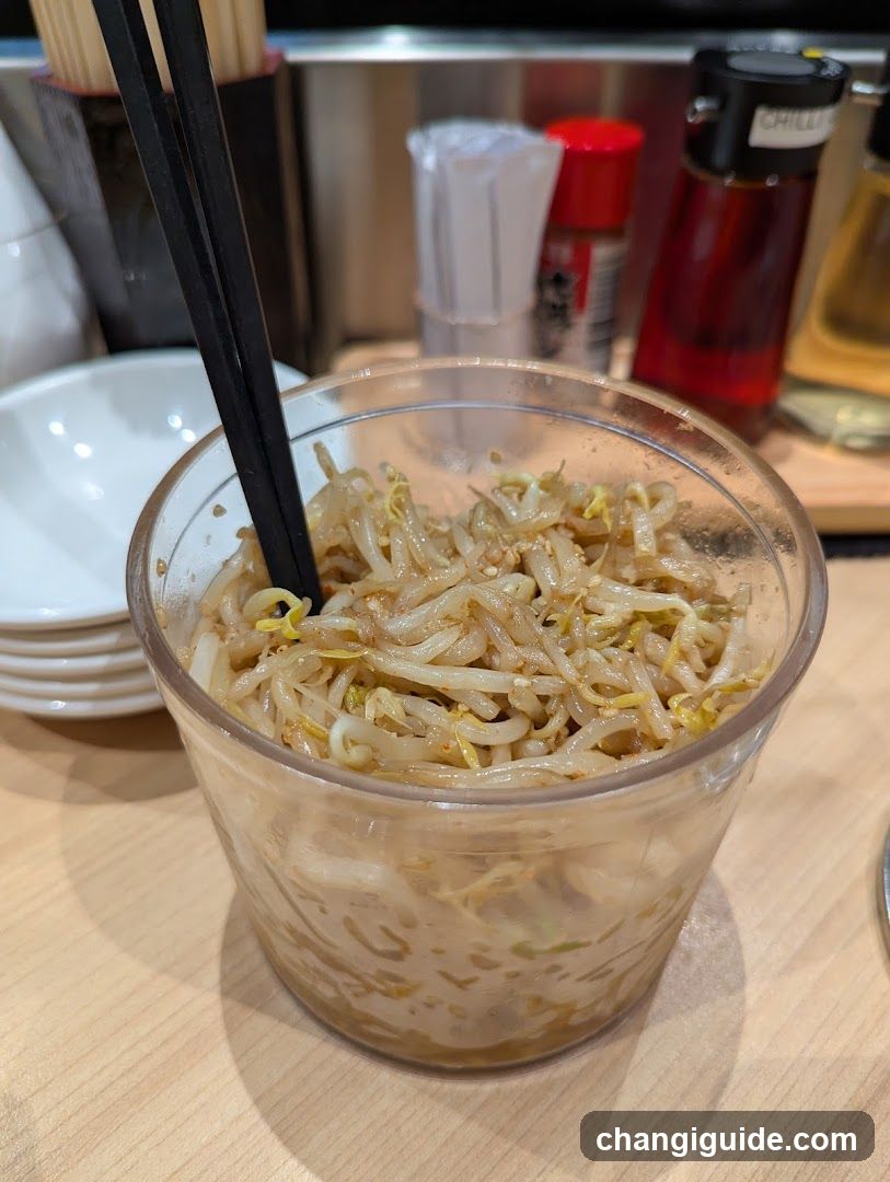 Bowl of bean sprouts with chopsticks